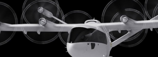 Front view of a white futuristic aeroplane with six spinning propellers against a black background.